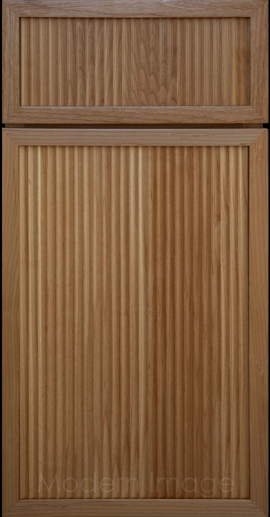Modern kitchen featuring Arcadia Cove Honey color stained cabinets with narrow frames and fluted center panels